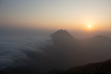 Beautiful landscape at Sunset Peak - Tai Tung  Shan, with sea of clouds. Lantau Island, Hong Kong. Looking to Lantau Peak from Sunset Peak at sunset time.