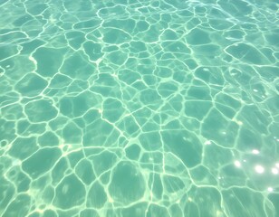 Obraz premium Clear water surface with sunlight reflections and shimmering waves