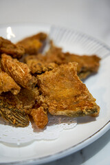 A plate of fried crispy fish bones