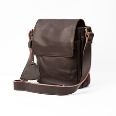 Blank brown leather shoulder bag isolated on white background, perfect for leather product catalogue