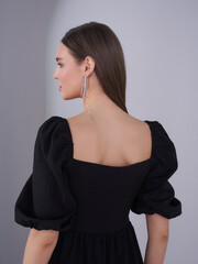 Captivating model showcasing elegant fashion in a studio setting with a modern touch