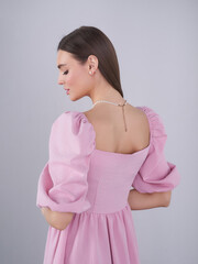 Elegant female model showcasing contemporary fashion in a studio setting
