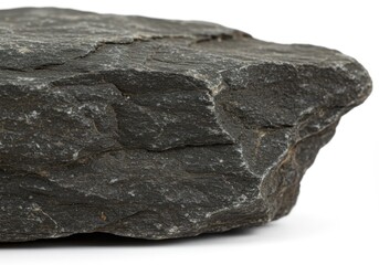 A dark textured rock formation