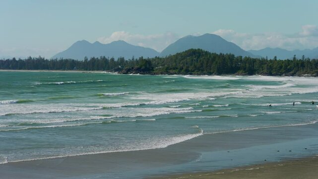view of the sea from the beach in Tofino with waves.
