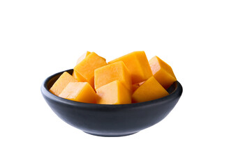 cheddar cheese cut into cubes in black plate isolated on white background .