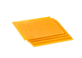 slices of red cheddar cheese isolated on a white background .