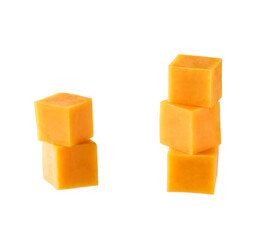 cheddar cheese sliced ​​into cubes isolated on white background.
