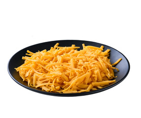 shredded cheddar cheese in a black plate isolated on a white background.