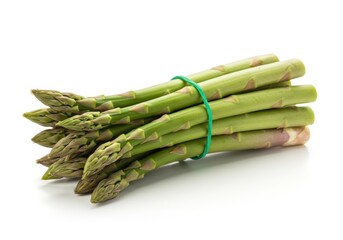 Bundle of fresh green asparagus spears tied with a green rubber band on a white background