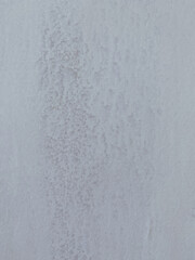 White paint scratch texture on the wall for background.