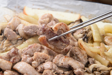 Duck meat grilled on a stone grill
