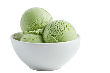 Bowl filled with three scoops of refreshing green ice cream on a dark background