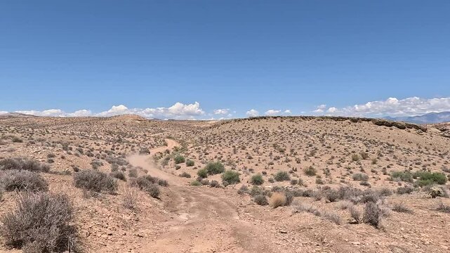 Drive off road desert trail recreation Utah POV fast motio. Off road trail riding in 4x4 all terrain vehicle for sport recreation. Nevada Utah border near St George Utah and Mesquite Nevada. Dry arid.