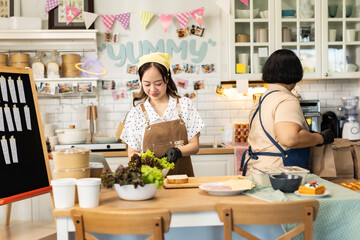 Small business owners are selling .Asian bakery  cake shop owner enjoy posting picture and review her cake on social media or online marketing streaming publish for advertising small business making m