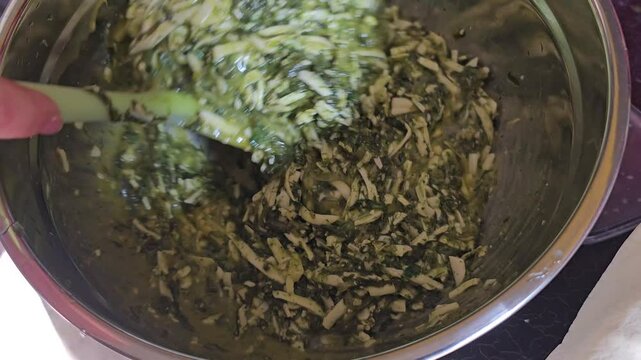spinach pie recipe Hand Preparing a Delicious Fresh Spinach and Cheese Filling for Pastry Artisanal Creation