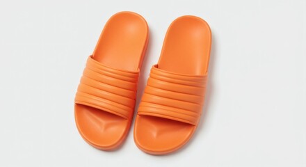AI image of a pair of bright orange rubber slide sandals with a striped strap, isolated on white background.