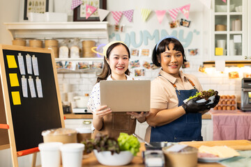 Small business owners are selling .Asian bakery  cake shop owner enjoy posting picture and review her cake on social media or online marketing streaming publish for advertising small business making m