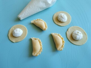 Dumplings with cottage cheese. Modeling dumplings. Cooking dumplings