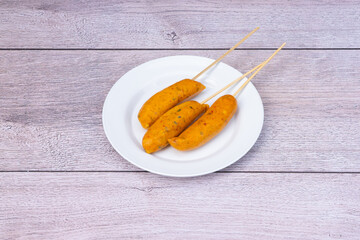 The grilled sausage and meat ball in Thai style