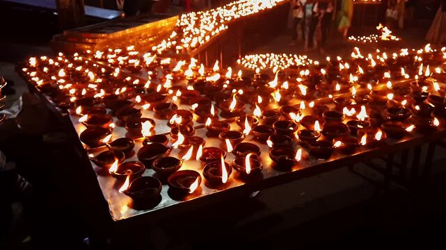A video of thousands of clay diyas being ignited during a Hindu religious festival celebration