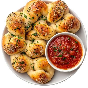 Garlic knots topped with parmesan and fresh parsley isolated on white background