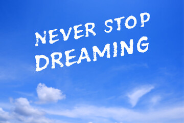 Never Stop Dreaming, text words typography in the blue sky, life and business motivatiobal inspirational concept
