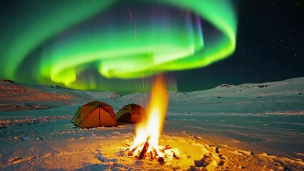 Camping tent and campfire northern lights glow in the snow forest mountains, Full shot, loop - Powered by Adobe