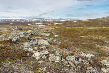 The treeless and rugged terrain of the highlands in the Varangerhalvøya National park, Northern Norway