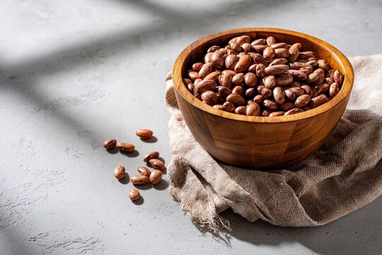 tempting pinto beans in the sunny corner on a light gray background