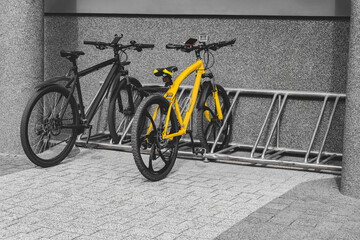 Bicycles are parked on a city street.