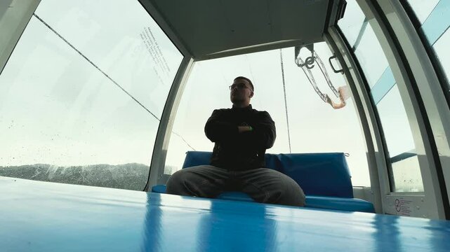 a man rides alone in a gondola
