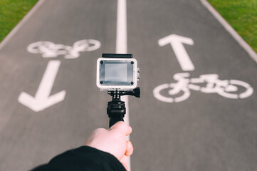 Close-up of action camera waterproof case in a man's hand.