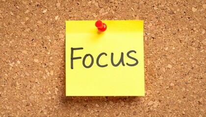 Motivational yellow sticky note focus on corkboard with red pushpin workspace inspiration office environment