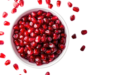 Ripe pomegranates, a closeup of vibrant red fruits bursting with juicy seeds juicy