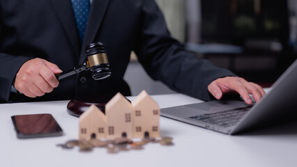 Real Estate Law Professional With Wooden House Finance On Laptop