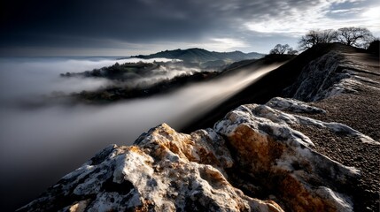 Fototapeta premium Majestic mist-shrouded landscape. Rocky outcrop viewpoint