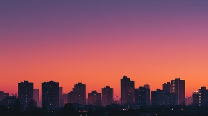 Obraz premium City skyline silhouette against a warm dusk sky, urban simplicity meets serene twilight.