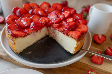 Strawberry cheesecake fresh and homemade baked on light background