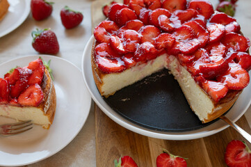 Strawberry cheesecake fresh and homemade baked on light background