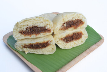 Baozi or bakpao is a Chinese Steamed Bread which is a type of yeast filled bun used in various Chinese dishes.