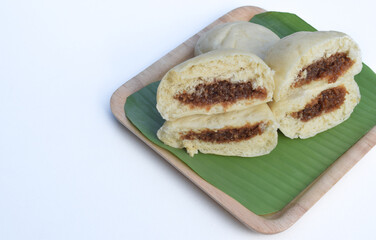 Baozi or bakpao is a Chinese Steamed Bread which is a type of yeast filled bun used in various Chinese dishes.