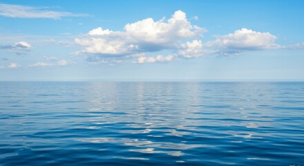 Obraz premium Serene Blue Ocean Under a Calm Summer Sky