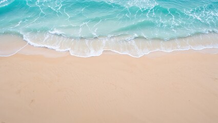 Top view of beautiful sandy beach and soft blue ocean wave. Tourism relaxation holiday concept