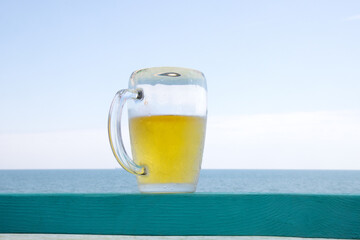 Beer and sea horizon composition