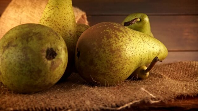 Whole pears warm rustic backdrop presentation stock footage
