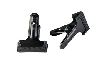 Black plastic spring clamp isolated on transparent background.