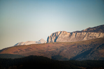 Majestic mountains rising above lush green forest in aiaraldea, basque country