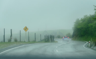 Winding road in the storm. Golden bay. New Zealand. © Janice