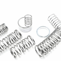 Metal steel spring spare parts for industry isolated on white background