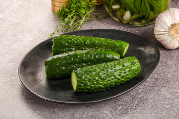 Homemade lighty salted cucumbers with herbs